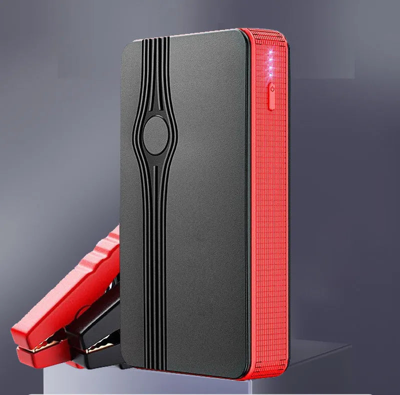 Red K4-E automobile emergency starting power supply unit with display, shown with data cable.