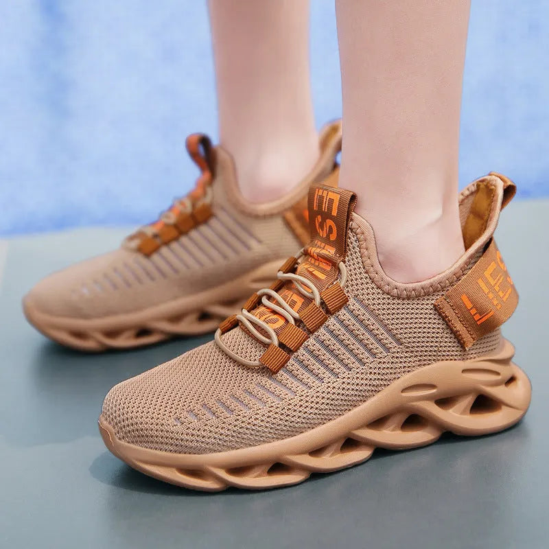 Kids fabric Velcro sneakers in black, khaki, or white with a textured EVA sole.