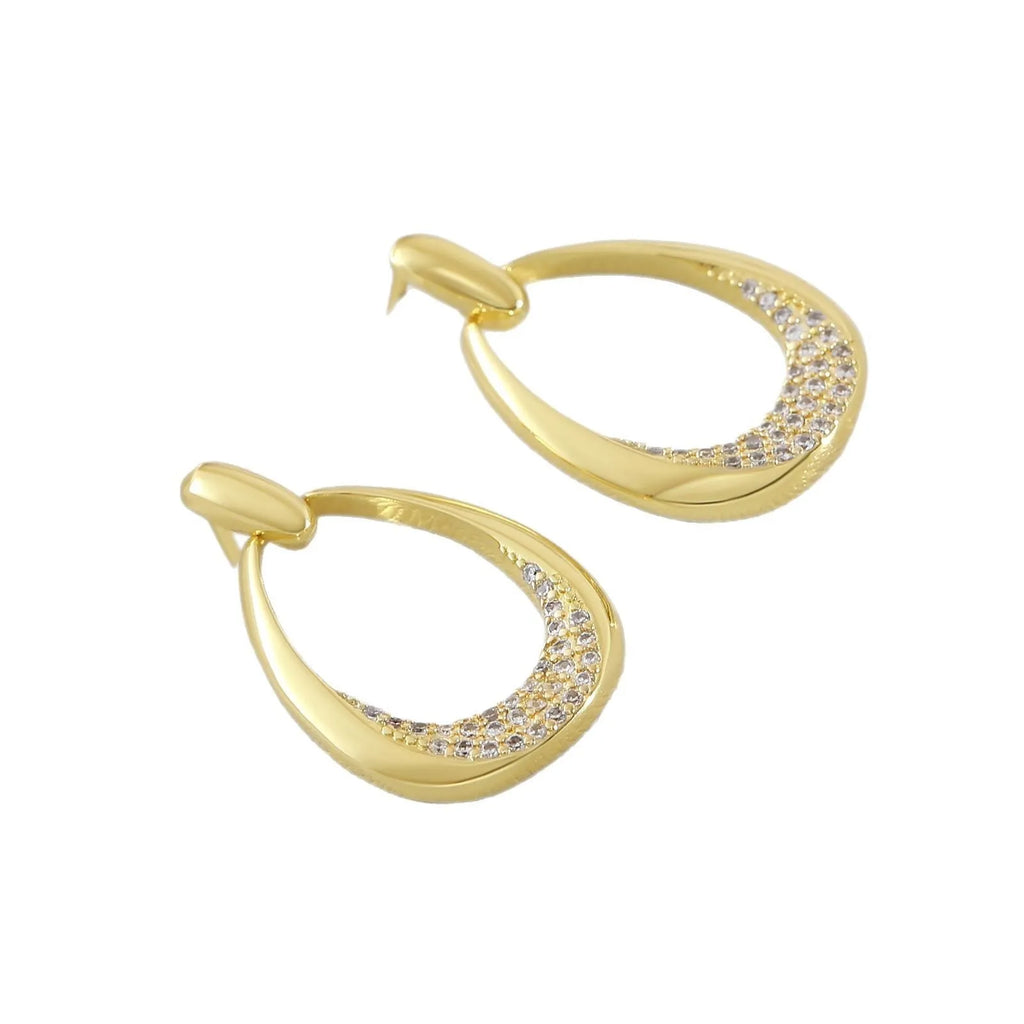 Geometric drop-shaped women's earrings in yellow gold colour with zircon design elements
