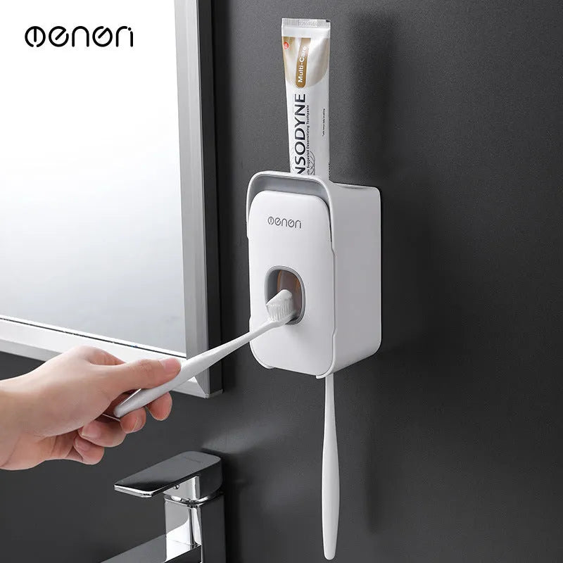 Automatic toothpaste dispenser in blue colour mounted on bathroom wall