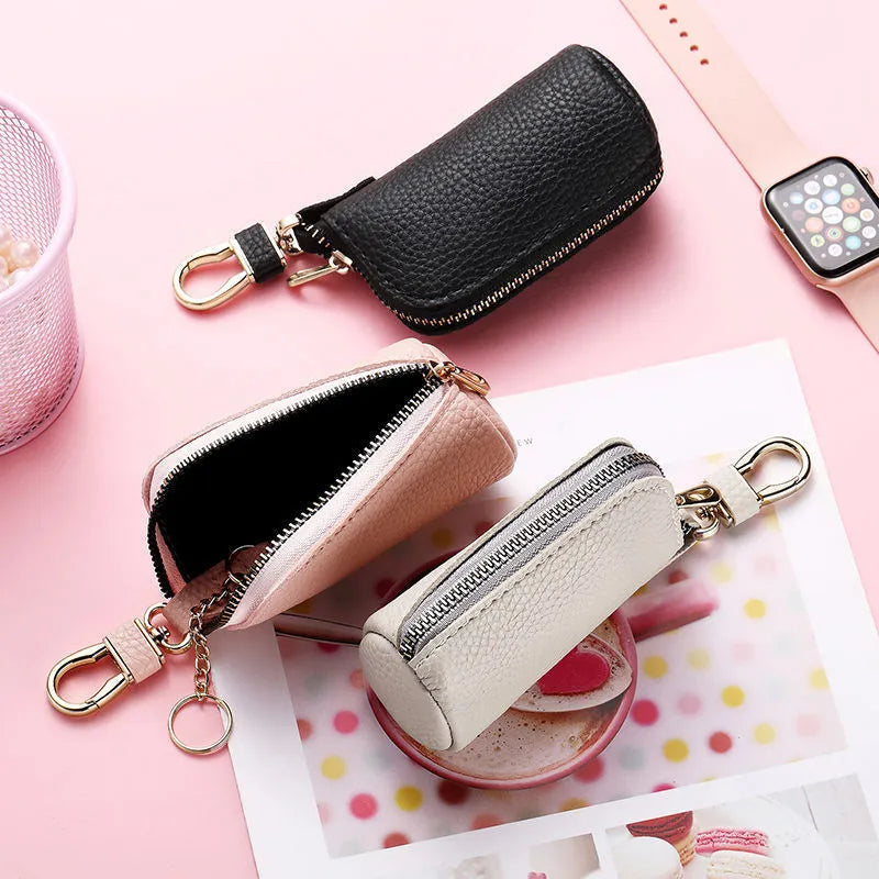 Men's black PU key case with zipper closure showing interior key organisation