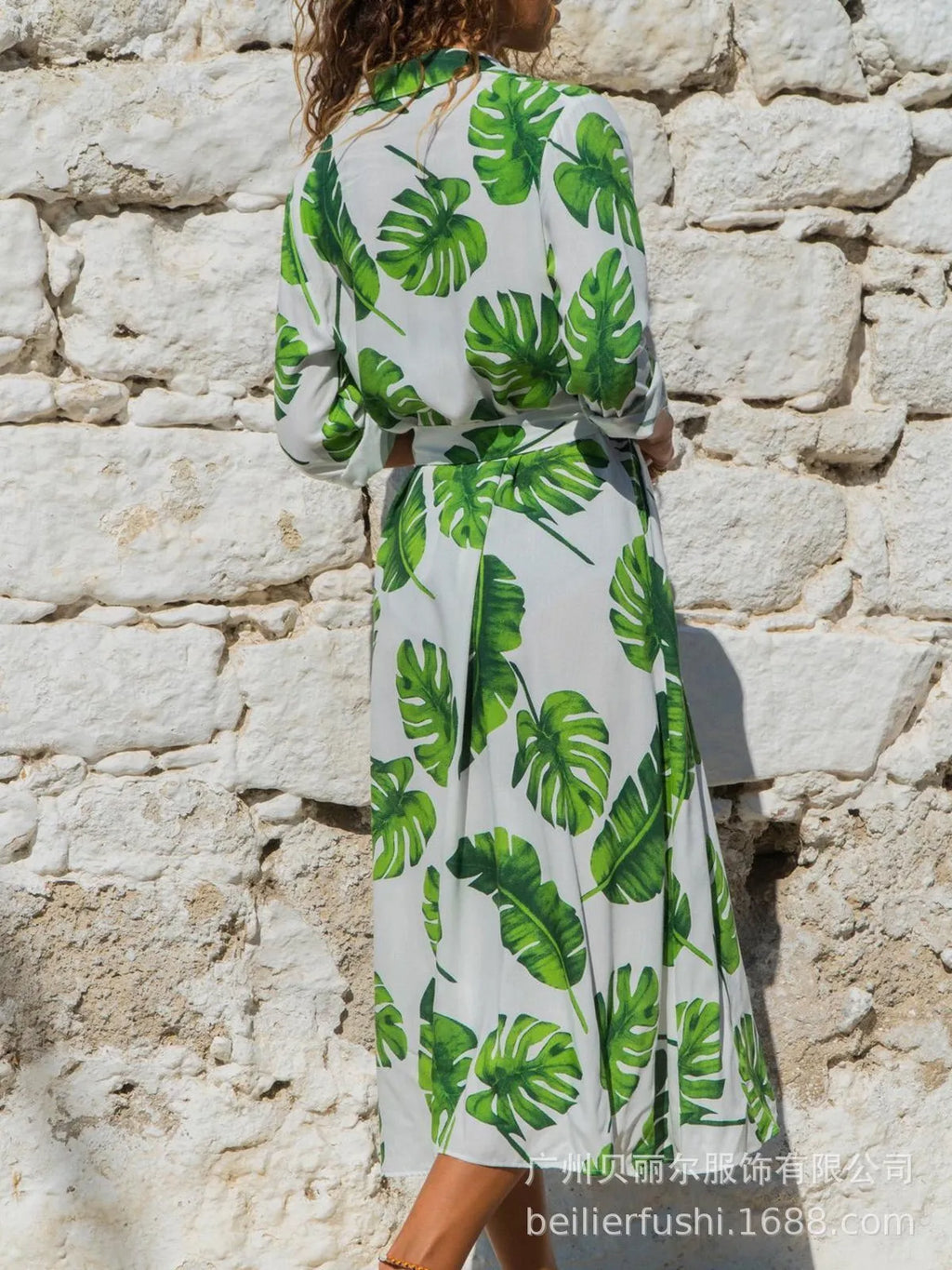 Women's printed chiffon V-neck dress with an A-line skirt on a hanger.