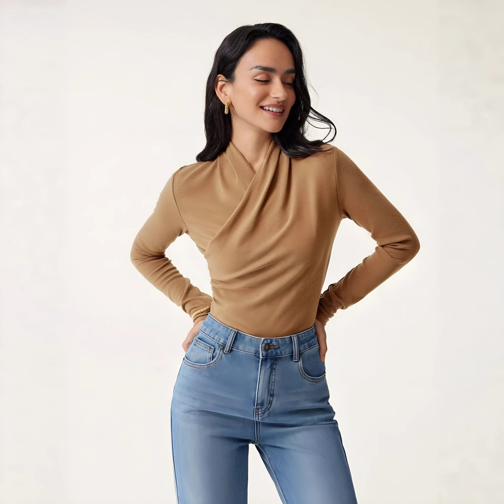 Camel-coloured slim fit women's long sleeve pullover sweater on a hanger.