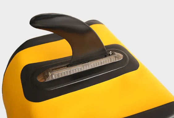 SUP paddle with large removable plastic fish fins showing screw attachment system