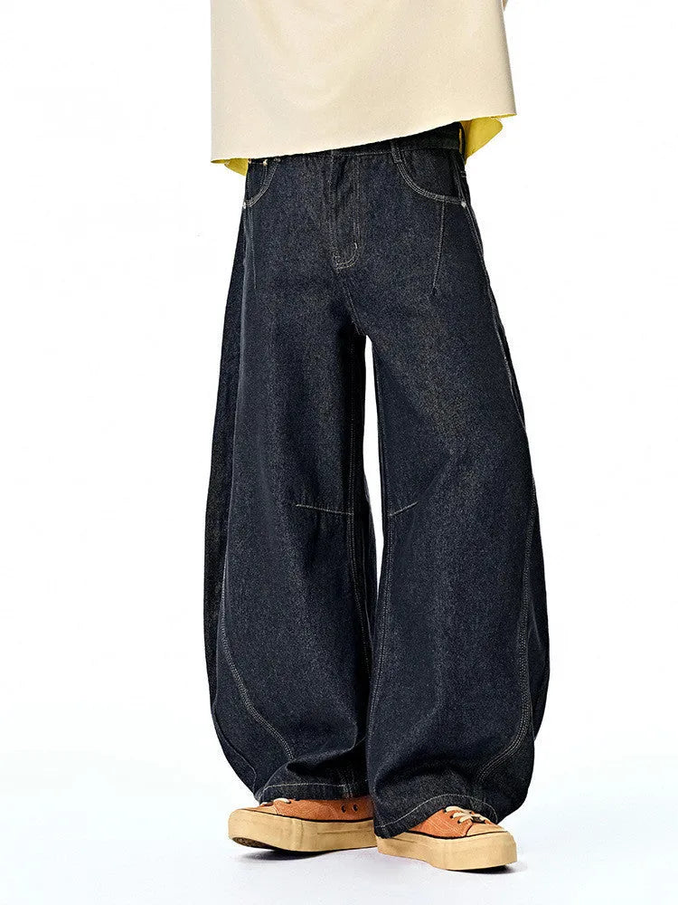 Men's wide leg denim trousers in original cow colour showing mid waist design and straight leg cut