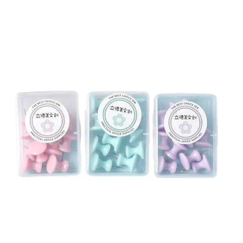Boxed set of macaron-coloured plastic push pins in cherry blossom pink, mint green, and lavender, showing large and small sizes.