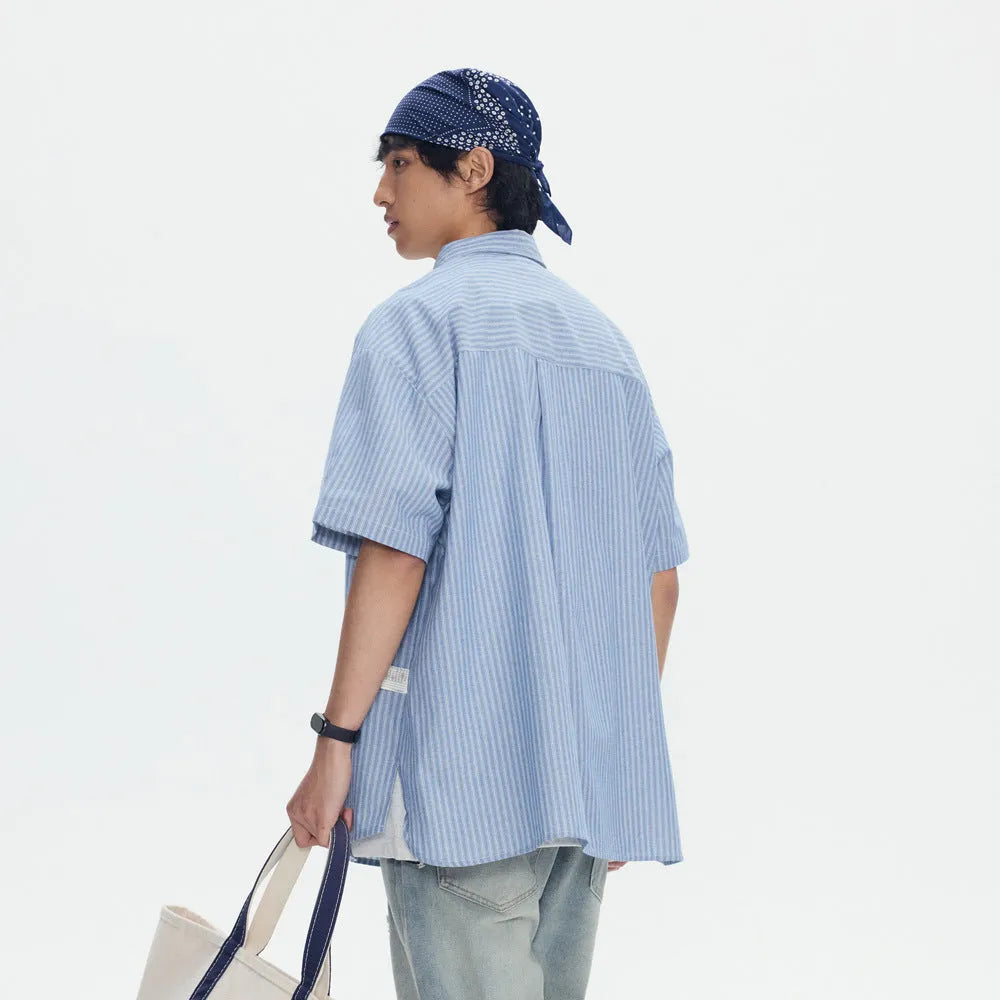 Blue and white striped short-sleeved cardigan-style shirt on a hanger