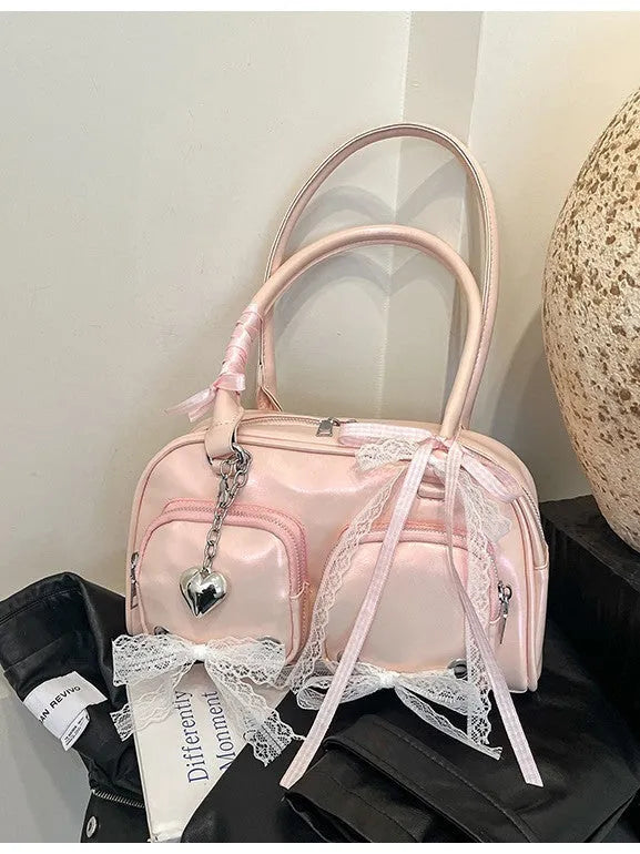 Casual shoulder bag in horizontal square design with cross-body strap, showing internal mobile phone pocket organisation
