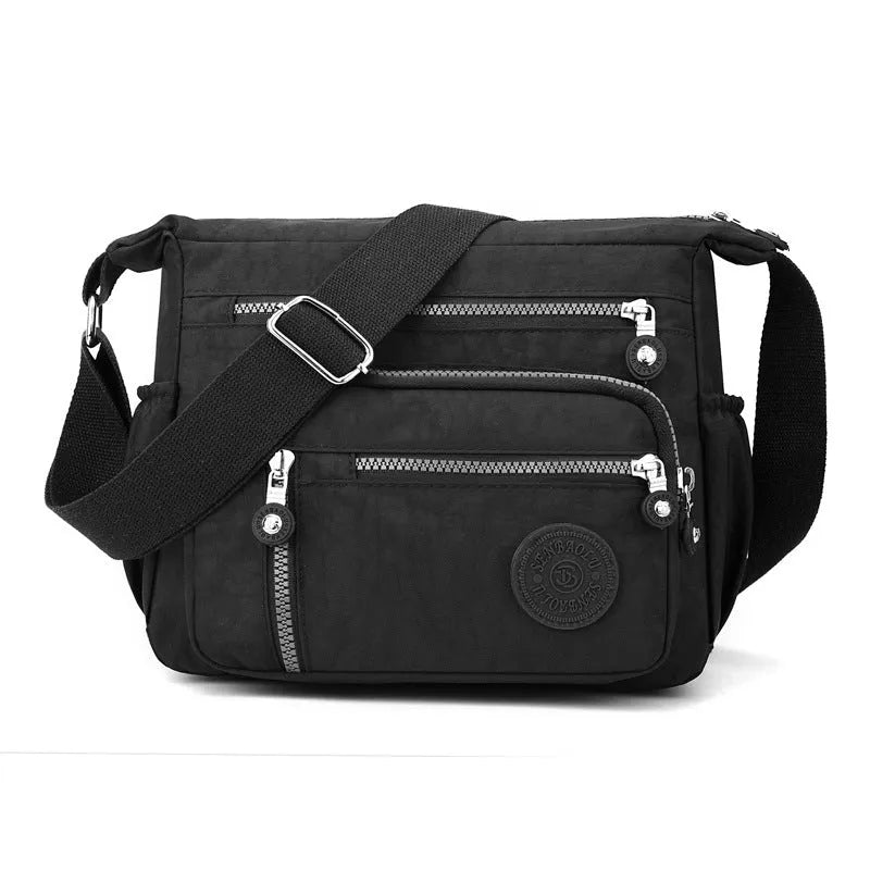 Nylon messenger bag with square vertical shape and single shoulder strap in available colours