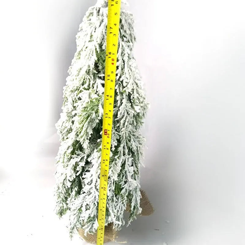 Small 24-inch white plastic Christmas tree with lights and snow sprayer decoration