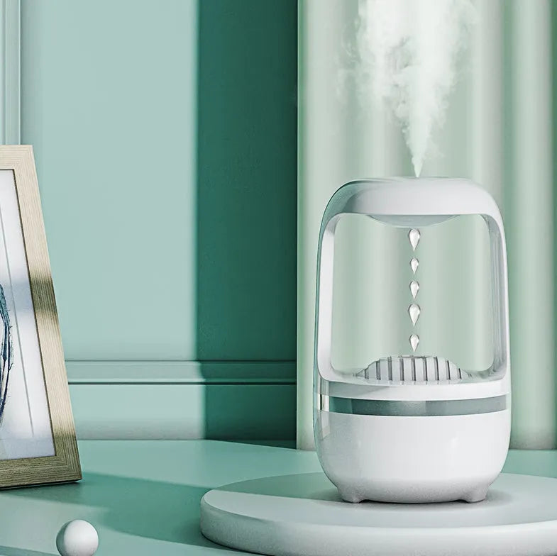 White anti-gravity water droplet humidifier with 500ml tank on a desk.