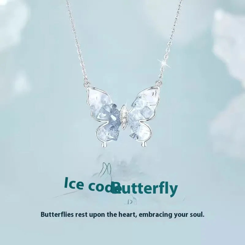 Silver butterfly necklace with adjustable chain showing pendant detail and O-ring links