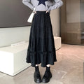 Korean style corduroy A-line midi skirt with elastic waistband in milky white, shown on a model.