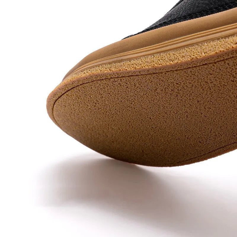 Men's black leather casual shoes with round toe, flat heel, and lace-up closure on rubber sole