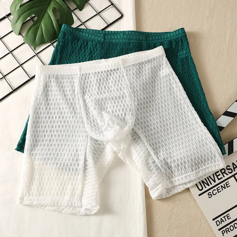 Men's lace boxer shorts in a lengthened hip lifting design, shown in one of five solid colours.