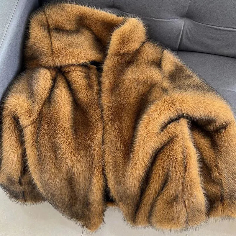 Silver grey women's mid-length artificial fur coat with loose fit and regular sleeves.