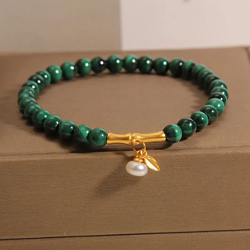 Women's adjustable white crystal bracelet with lucky bamboo charm in high-rise setting