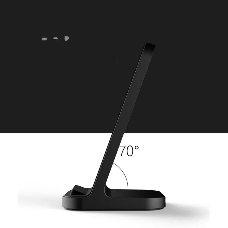 Dark grey vertical wireless charging stand for smartphones on desktop