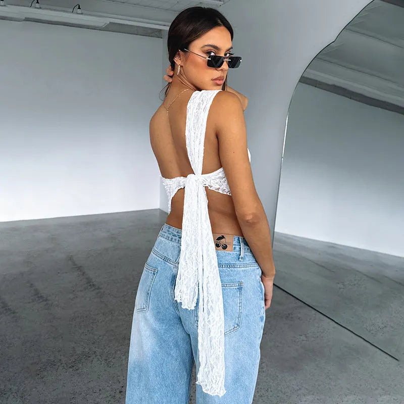 Women's apricot lace backless sleeveless vest top with an asymmetrical neckline on a model.