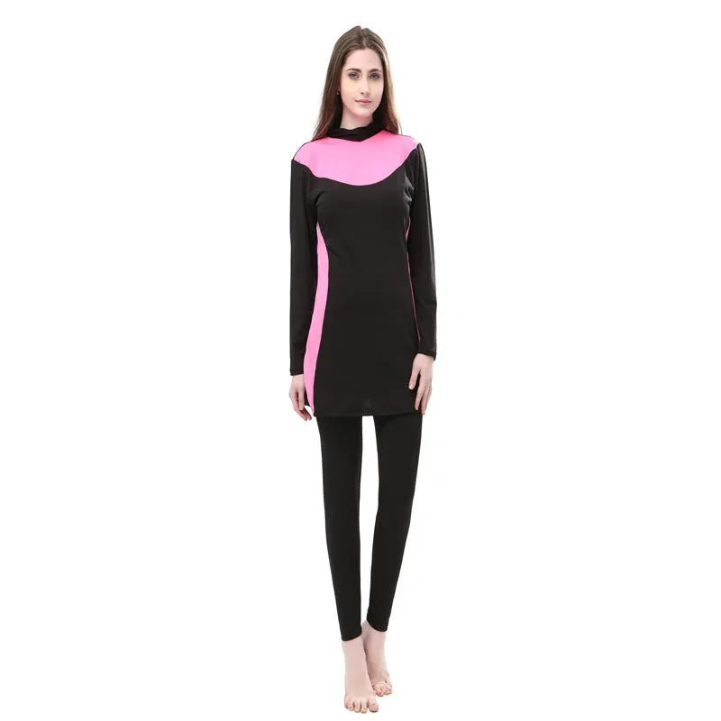 Women's black and blue hooded long sleeve swimsuit top and pants on a hanger.