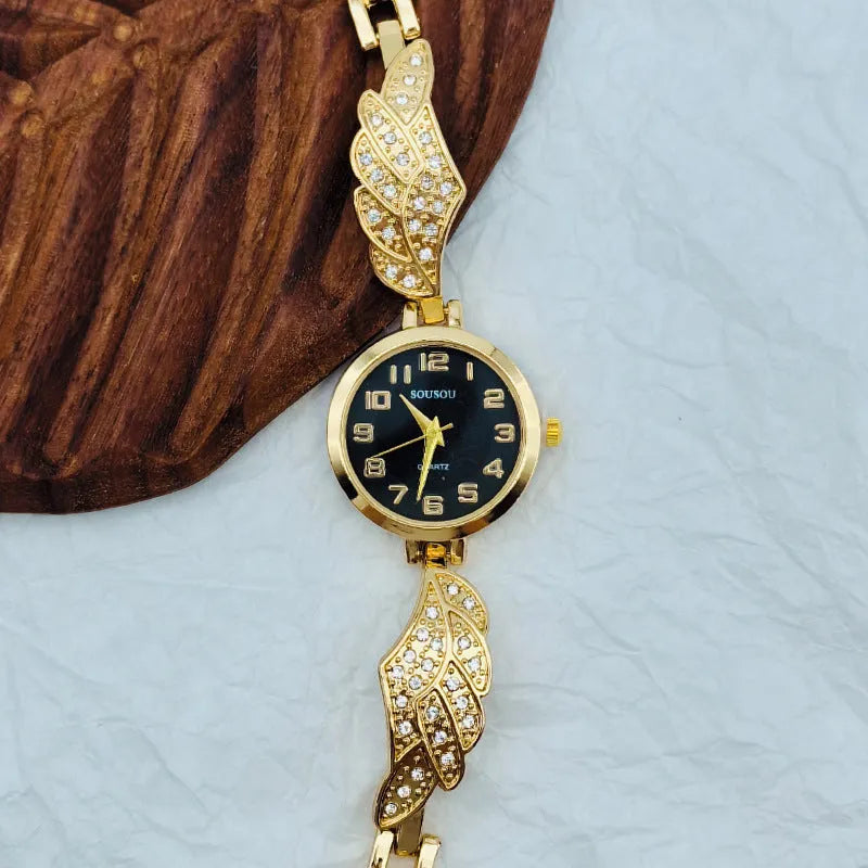 Stainless steel women's watch with round dial on wrist, showing Vachette clasp buckle