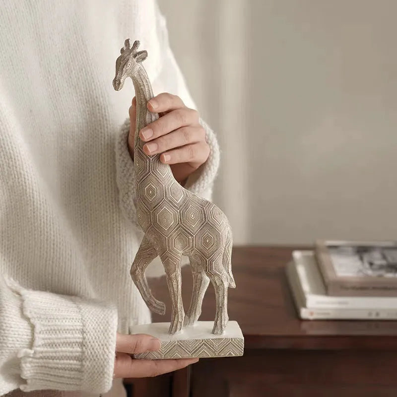 Wood colour synthetic resin giraffe ornament measuring 30.5 cm tall on a shelf.