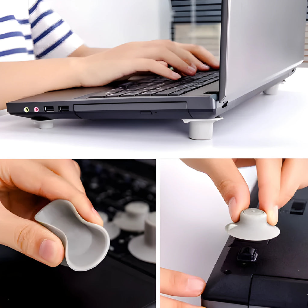 Grey plastic laptop cooling stand with four non-slip pads on a flat surface