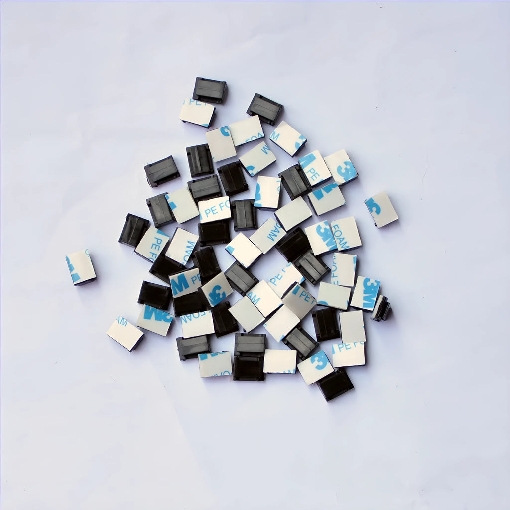 Black PA66 plastic wiring management clips for automotive and electronic cable organisation.