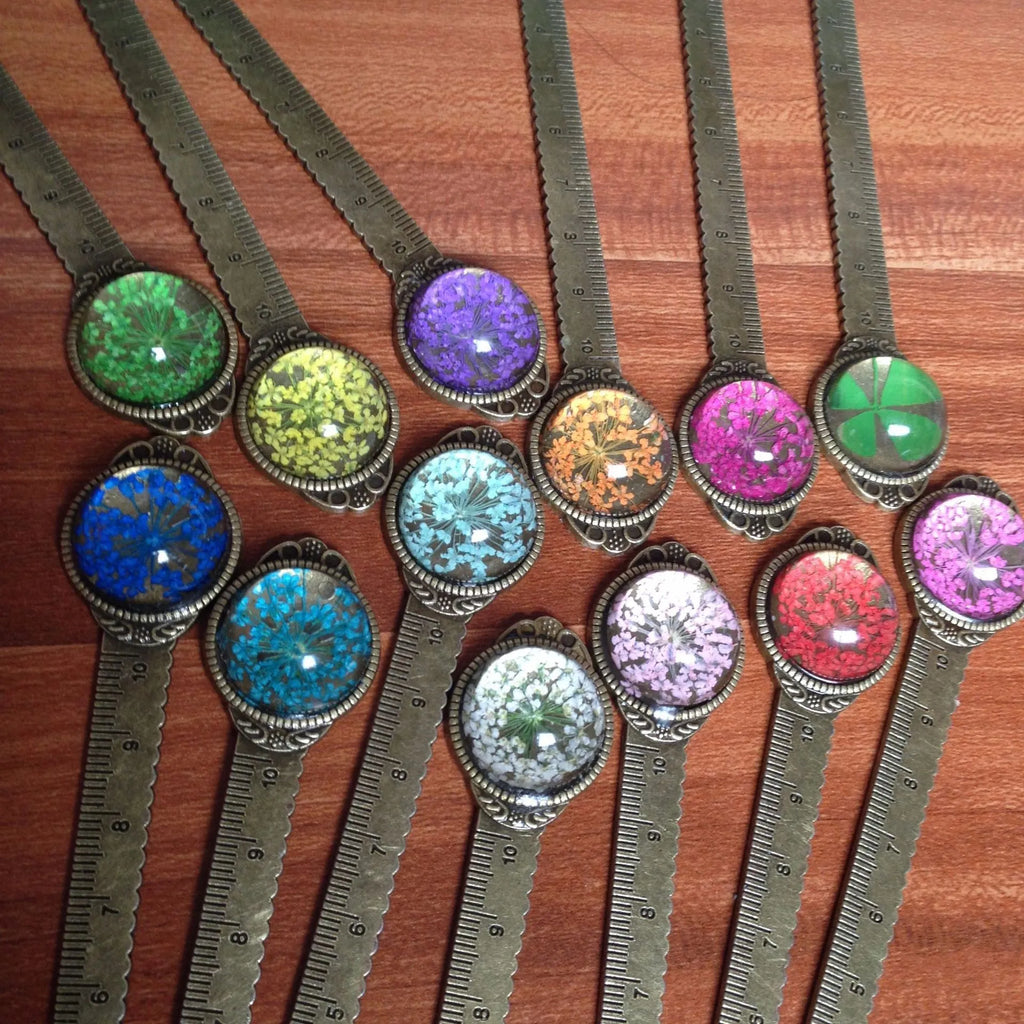Handmade dried gypsophila flower bookmark ruler showing lace flowers, daffodils, and clovers on 12cm length