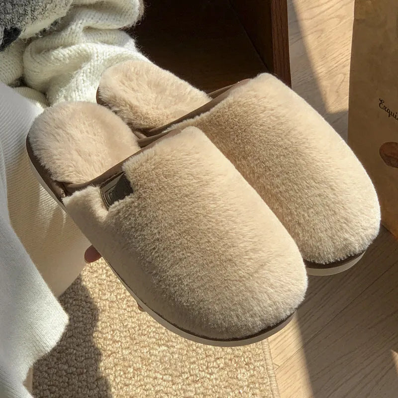 Winter plush slippers in blue colour with non-slip PVC soles, showing car stitching detail
