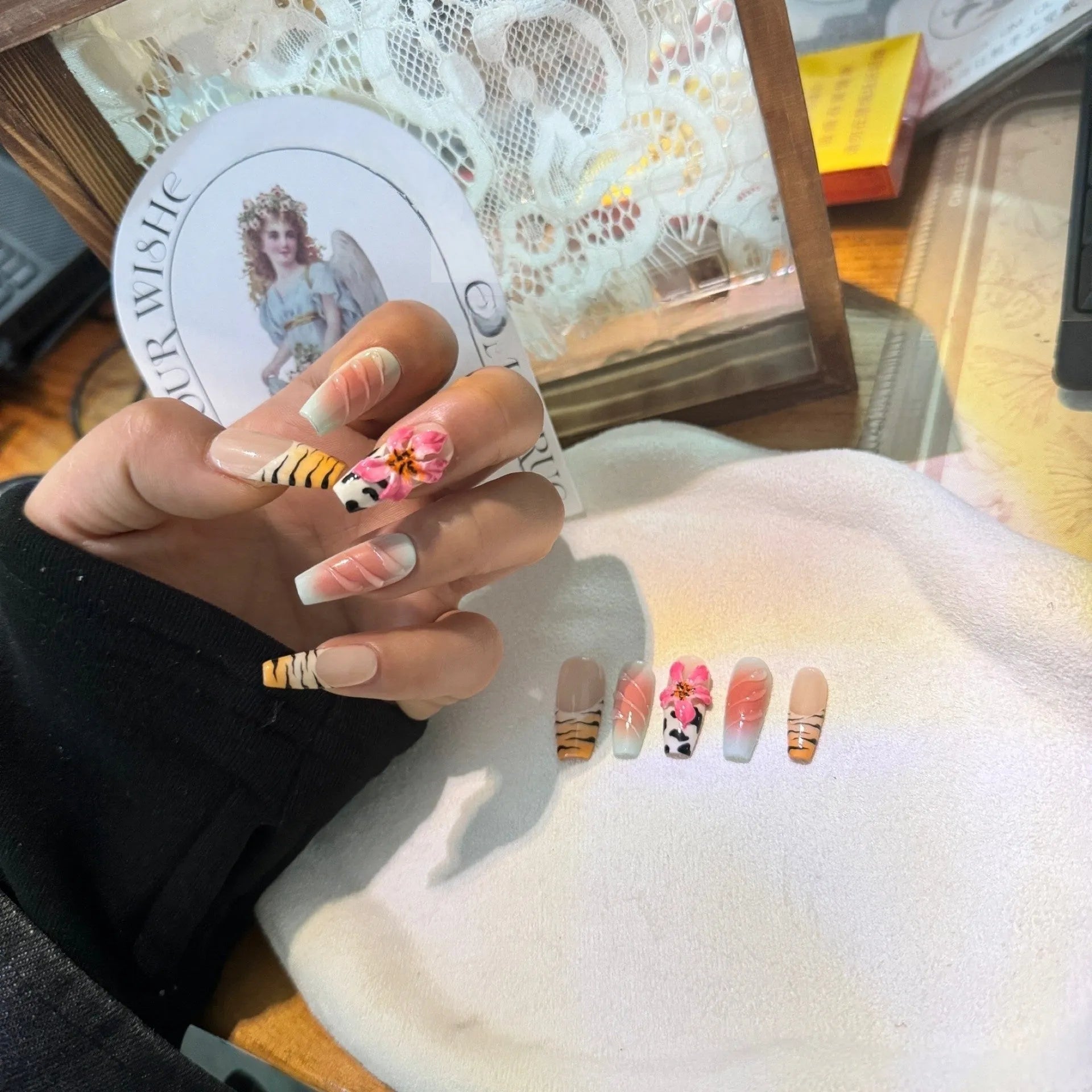 Zebra pattern lily hand carving nail art set with embossed flower and leopard print designs.