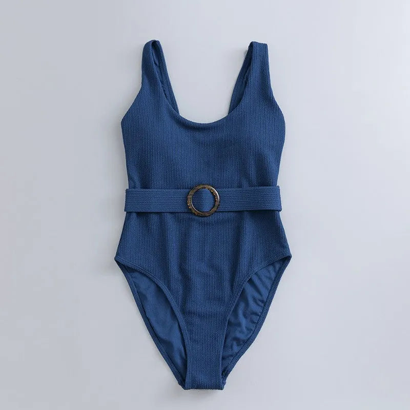 Navy blue one-piece women's swimsuit with triangle design and chest pads on a mannequin