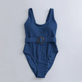 Navy blue one-piece women's swimsuit with triangle design and chest pads on a mannequin