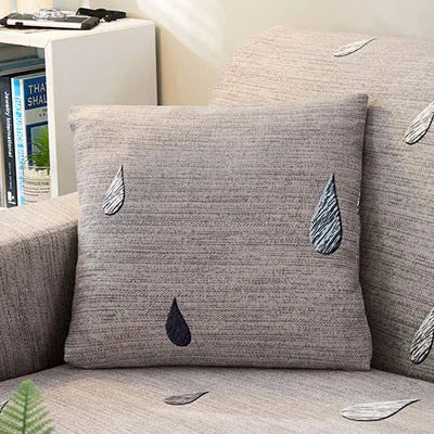 Printed geometric abstract stretch sofa slipcover fitted on a double-seater sofa.