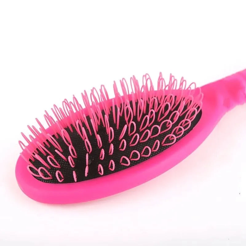 Black and pink ABS plastic ring tooth hair extension comb with airbag cushion base.