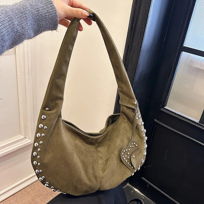 Soft plush retro style women's handbag in strapless tote design showing colour options