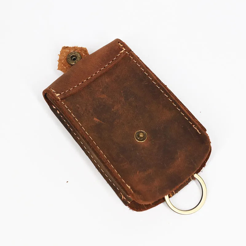 Crazy horse leather key case in dark brown, 7cm by 11.5cm, resting on a surface