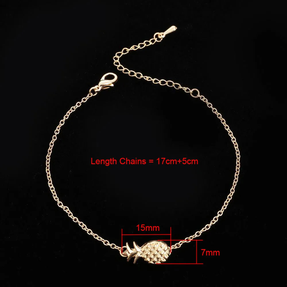 Close-up of a women's alloy bracelet with a small pineapple charm in gold or silver.
