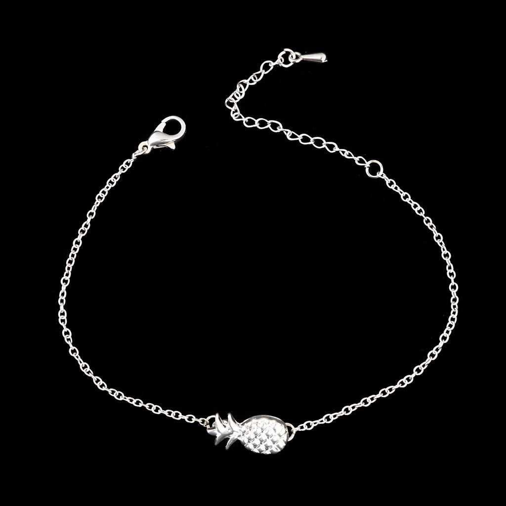 Close-up of a women's alloy bracelet with a small pineapple charm in gold or silver.