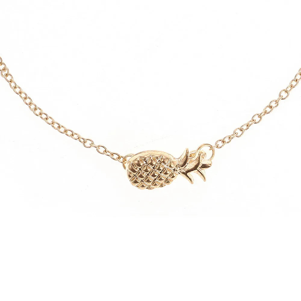 Close-up of a women's alloy bracelet with a small pineapple charm in gold or silver.