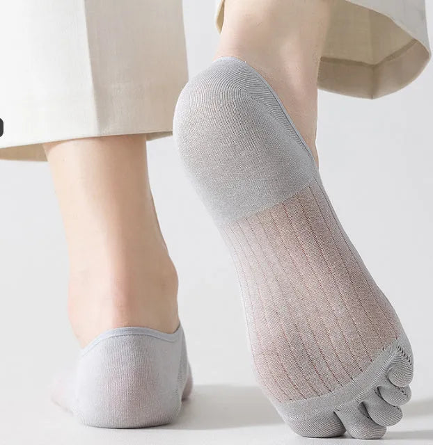 Ultra-thin modal cotton five-finger boat socks in black, shown on a foot.