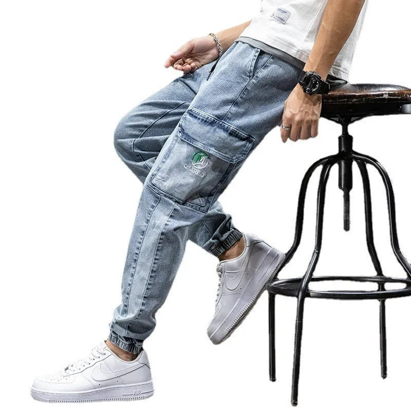 Men's loose fit straight leg cargo jeans in cotton with micro elasticity, shown in blue.