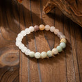 Retro style long beaded necklace and matching bracelet set in geometric round beads.