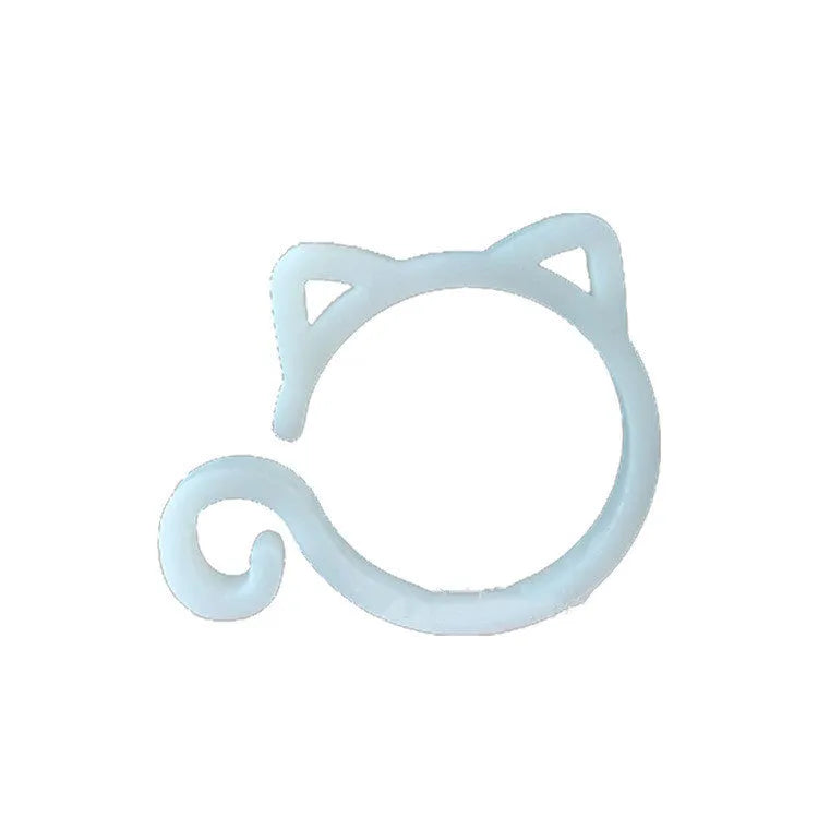 Small green cat-shaped plastic plant clip for supporting vines and stems in the garden.