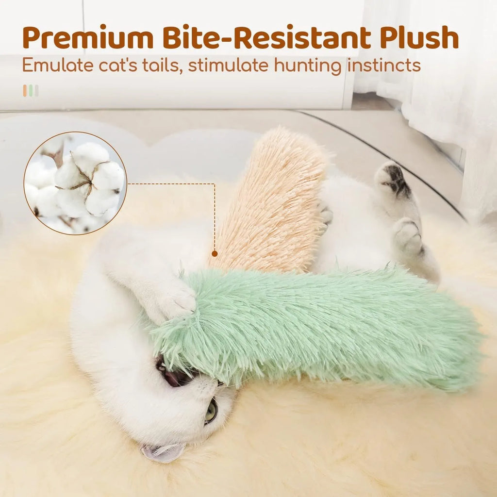 Soft plush cat toy pillow in blue, green, pink, and white colours, shown next to a measuring tape indicating 27cm length.