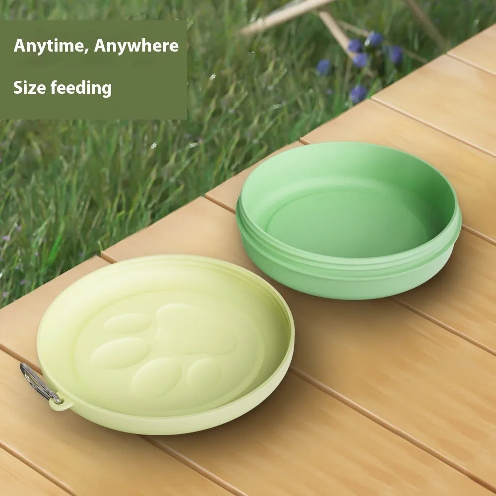 Portable dog food bowl with snack compartment in light green colour