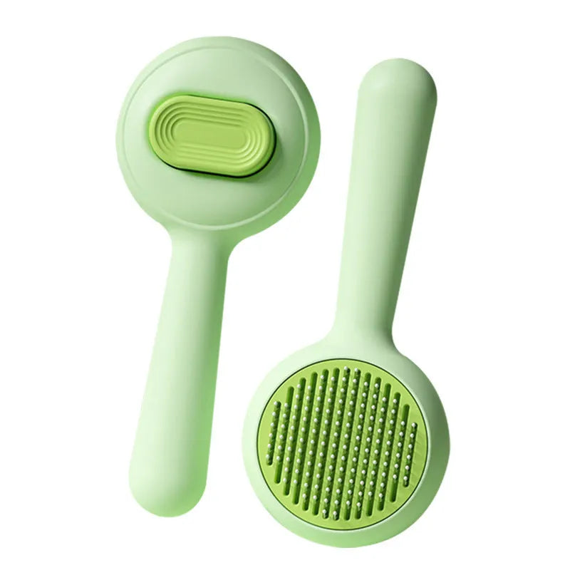Green or yellow cat grooming brush with stainless steel comb teeth and a non-slip plastic handle.