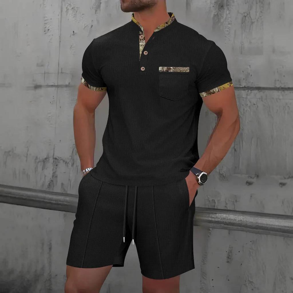Men's grey zip-up polo collar short sleeve suit with matching shorts laid flat