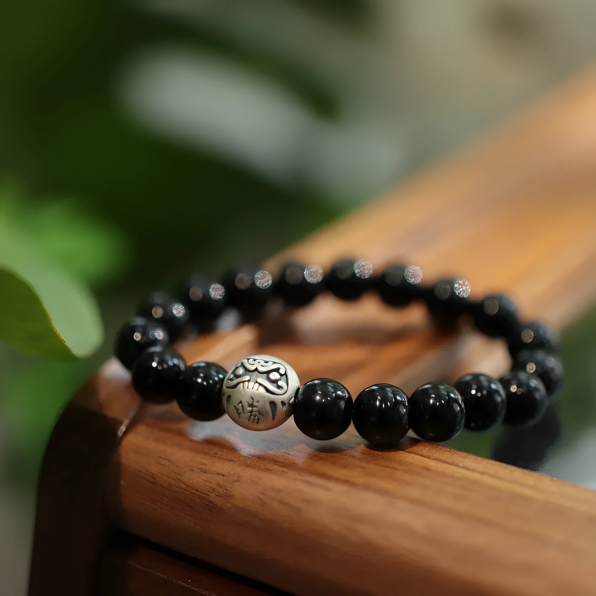 Women's black agate bracelet with 10mm beads and sterling silver in Chinese style design