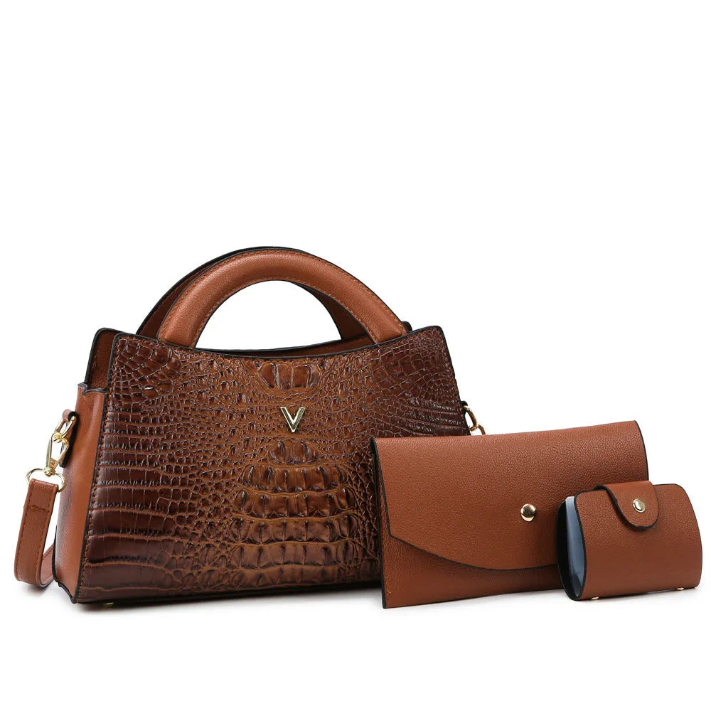 Women's black crocodile pattern crossbody handbag showing internal mobile phone and document compartments